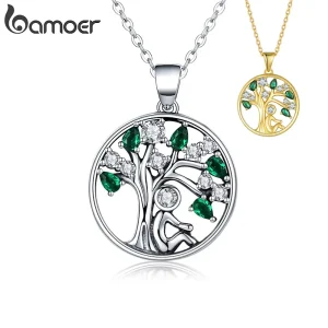 925 Silber Lebensbaum Anhänger mit Zirkonia, grüne Kristalle, Mensch-Silhouette. Halskette Detail zeigt filigrane Baumstruktur.