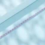 925 Silber Armband mit lila Baumwollschnur, verstellbar. Zarte Silber-Armkette mit pastellfarbenen, ovalen Schmucksteinen.