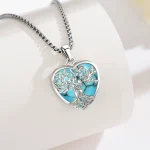 Türkis Herz Lebensbaum Halskette: Romantischer Paar-Schmuck mit Edelstein. Detail: Zarte Baumwurzeln umarmen das Liebespaar im Silberherz.